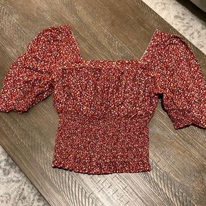 Red Universal Thread crop top with floral print.